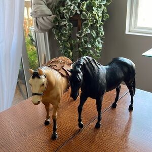 Two vintage collectible horses. 8” tall 12” length 5” width.